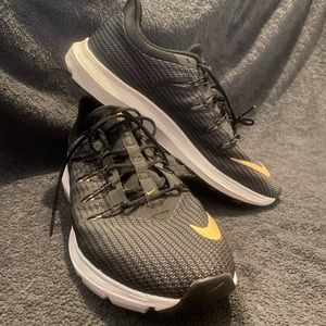 Black & Gold Nike Tennis Shoes